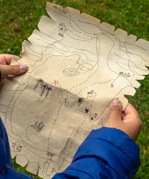 Person holding a hand-drawn treasure map during a family activity on Cheshire holidays Warrington.