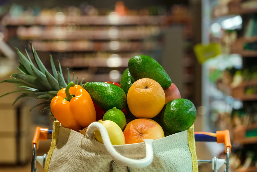 Eco-friendly shopping bag filled with fresh fruits and vegetables, part of local market visits on family days out Rother Valley.